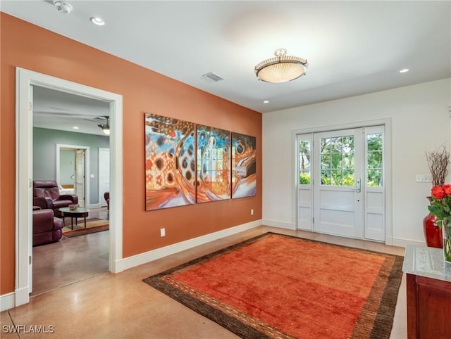 entryway with baseboards, visible vents, and recessed lighting