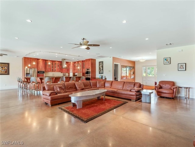 living room featuring ceiling fan, finished concrete floors, visible vents, and recessed lighting