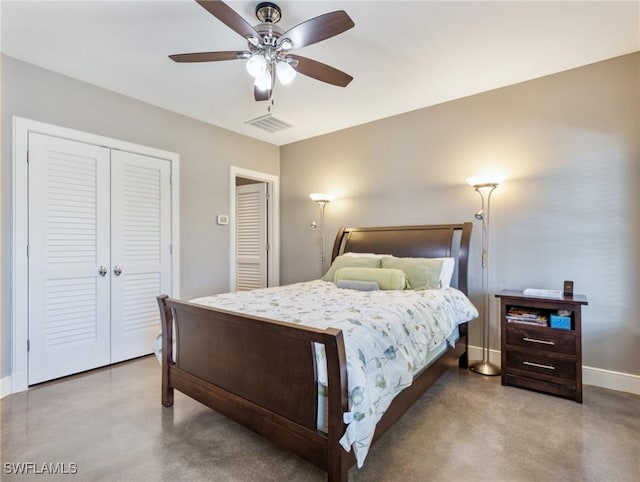 bedroom with visible vents, a closet, baseboards, and concrete flooring