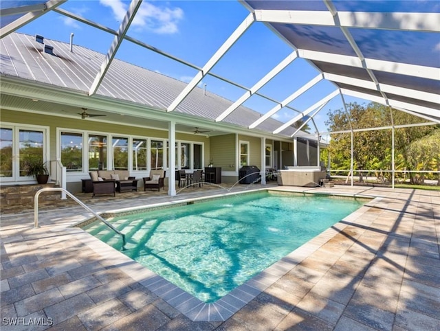 outdoor pool with area for grilling, glass enclosure, ceiling fan, a patio area, and outdoor lounge area