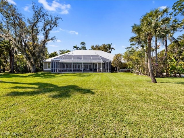 view of yard featuring glass enclosure