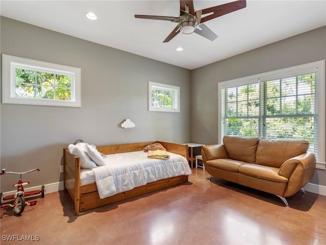 bedroom featuring ceiling fan, finished concrete floors, baseboards, and recessed lighting