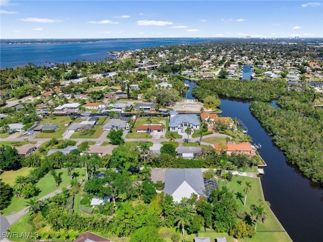 aerial view featuring a residential view and a water view