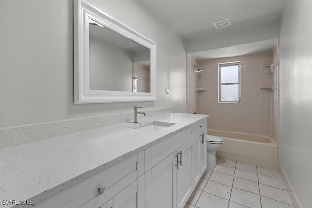 bathroom with visible vents, toilet, washtub / shower combination, vanity, and tile patterned floors