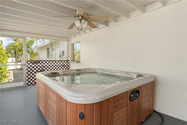 view of patio / terrace with ceiling fan and an indoor hot tub