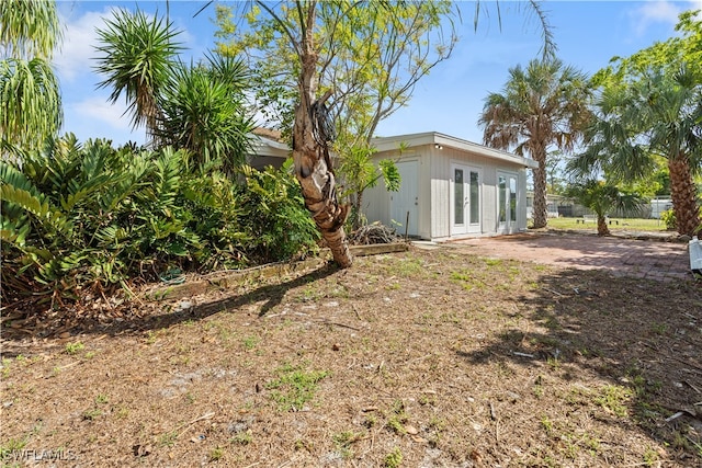 view of yard featuring french doors