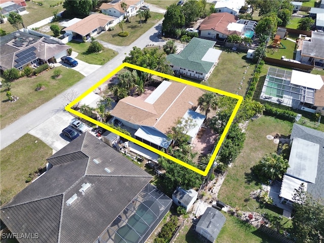 birds eye view of property with a residential view