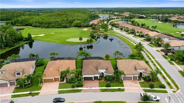 birds eye view of property with a residential view, a water view, and golf course view