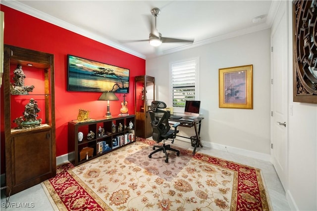 office space with crown molding, baseboards, and a ceiling fan