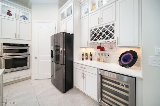 kitchen featuring double oven, wine cooler, light countertops, and black refrigerator with ice dispenser