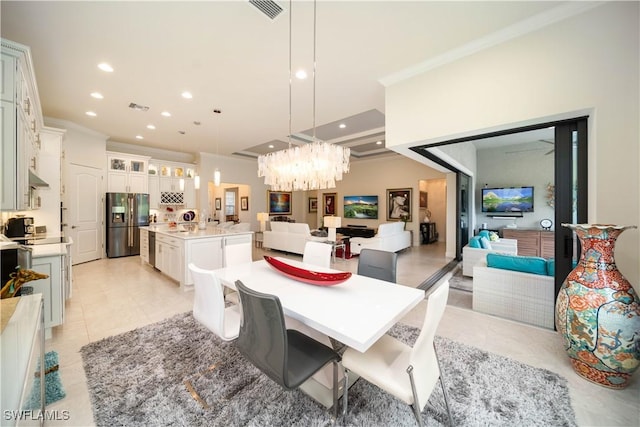 dining area featuring ornamental molding, visible vents, and recessed lighting