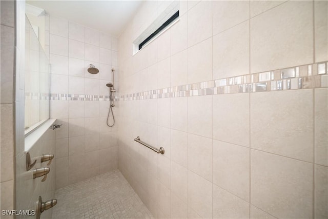 bathroom featuring tiled shower