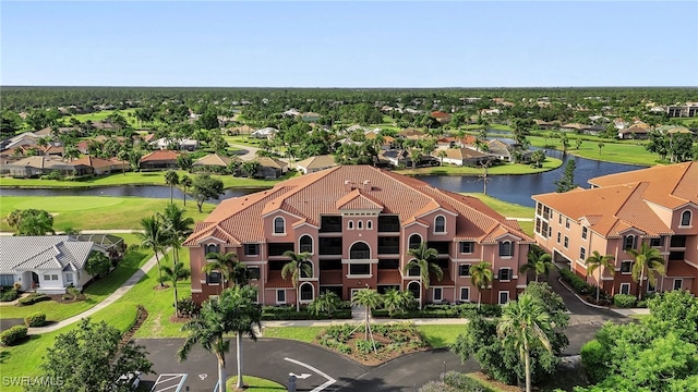 birds eye view of property featuring a residential view and a water view