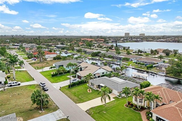 birds eye view of property featuring a residential view and a water view