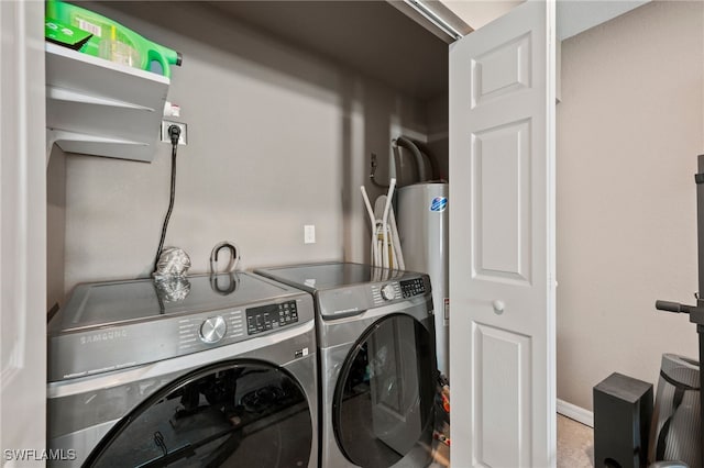 5011 Dania Cir, Labelle, FL 33935 - washroom featuring water heater, laundry area, independent washer and dryer, and baseboards