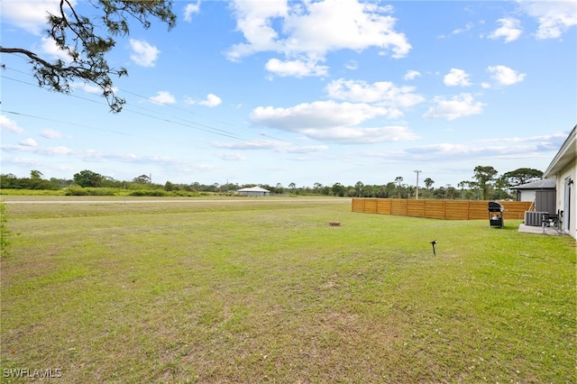 5011 Dania Cir, Labelle, FL 33935 - view of yard featuring central AC unit and fence