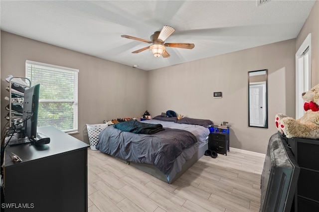 5011 Dania Cir, Labelle, FL 33935 - bedroom featuring a ceiling fan and wood finish floors