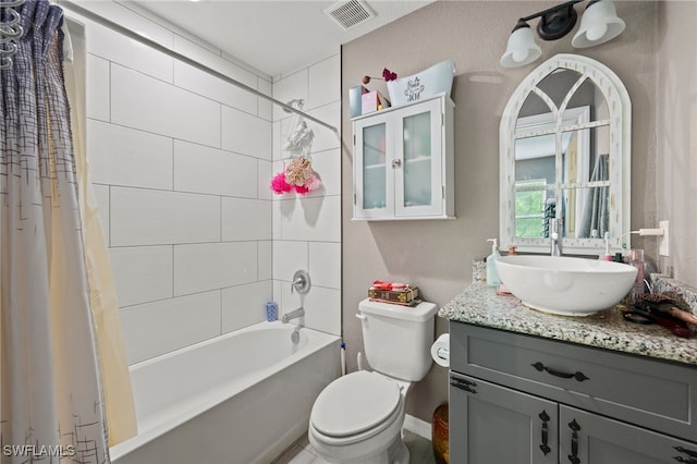 5011 Dania Cir, Labelle, FL 33935 - full bath featuring toilet, visible vents, shower / bath combination with curtain, and vanity