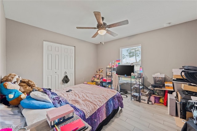 5011 Dania Cir, Labelle, FL 33935 - bedroom featuring a closet, ceiling fan, and wood finished floors