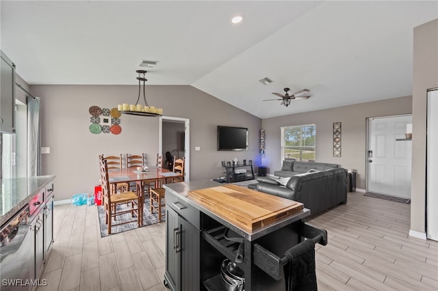 5011 Dania Cir, Labelle, FL 33935 - interior space featuring vaulted ceiling, wood finish floors, visible vents, and a ceiling fan