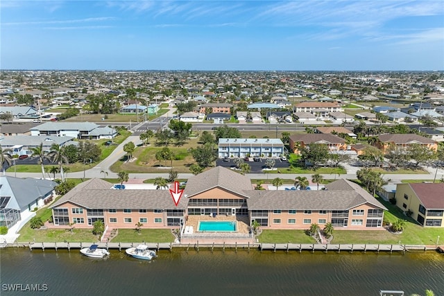 bird's eye view with a water view and a residential view