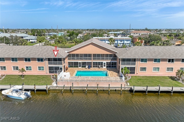 aerial view featuring a water view and a residential view