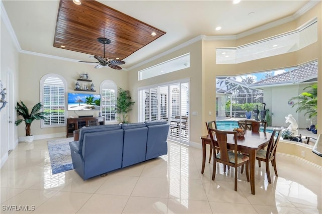 living area featuring light tile patterned floors, wood ceiling, baseboards, a sunroom, and crown molding