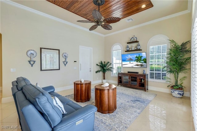 living area featuring crown molding, a ceiling fan, and light tile patterned floors