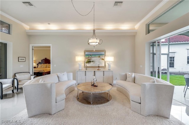 living area featuring visible vents and ornamental molding