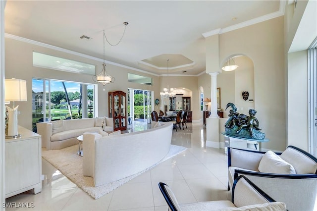 living area featuring arched walkways, crown molding, decorative columns, light tile patterned floors, and visible vents