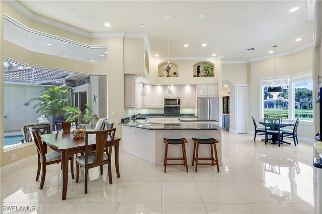 dining room with crown molding, visible vents, light tile patterned flooring, recessed lighting, and arched walkways