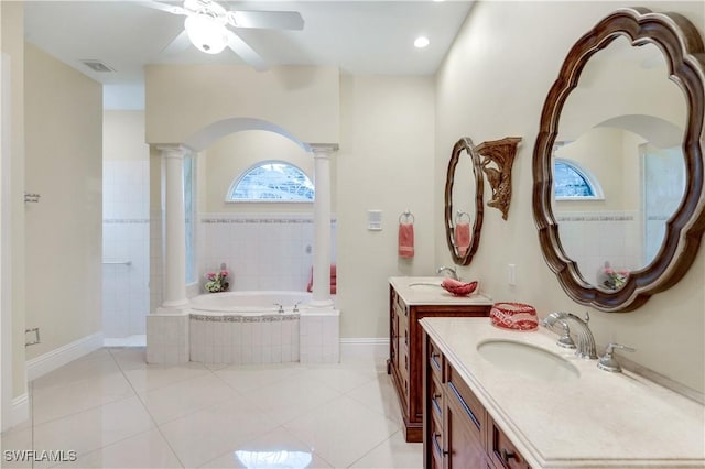 full bathroom featuring a ceiling fan, decorative columns, a bath, visible vents, and vanity