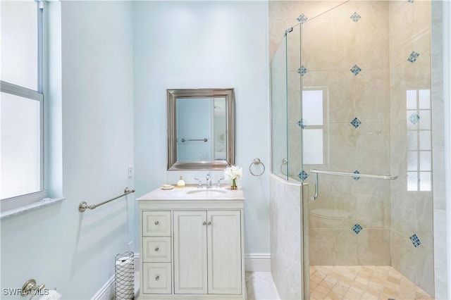 full bath featuring vanity and a shower stall