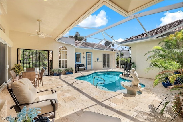 pool featuring ceiling fan, a patio, and a lanai