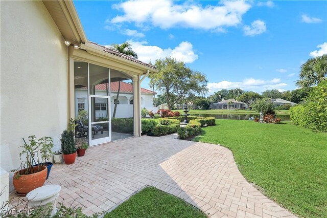 view of patio / terrace with a sunroom