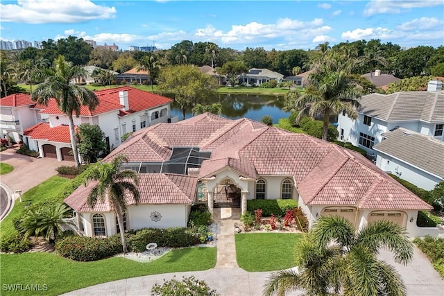 drone / aerial view with a residential view and a water view