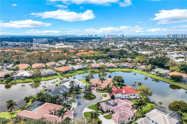 aerial view featuring a water view, a city view, and a residential view