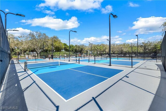 view of tennis court with fence