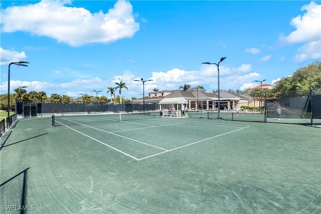 view of sport court with fence