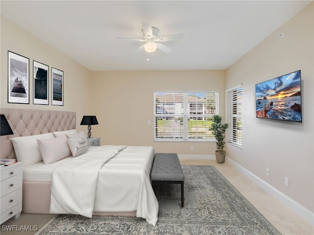 bedroom featuring ceiling fan and baseboards