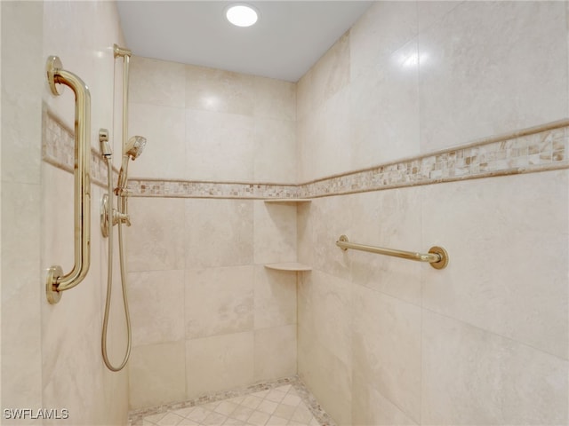 full bathroom with a tile shower