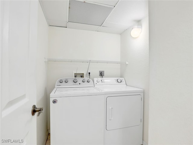 clothes washing area with laundry area and independent washer and dryer