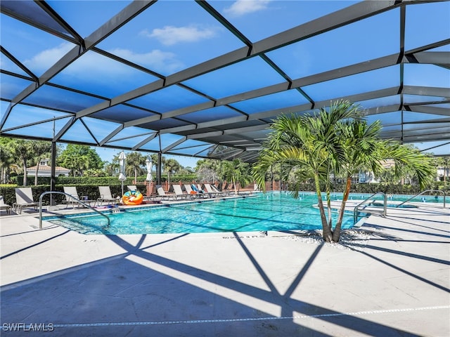 community pool with a lanai and a patio area