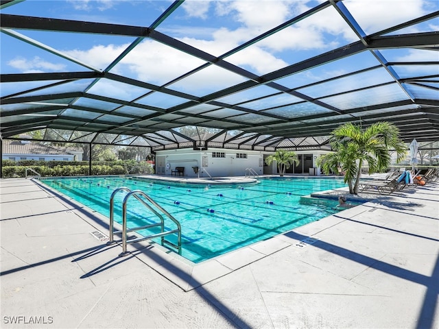 pool with a patio and a lanai