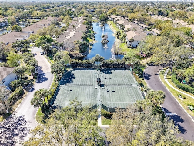 bird's eye view featuring a water view and a residential view