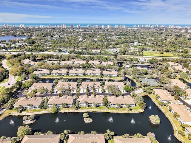 birds eye view of property featuring a water view and a residential view