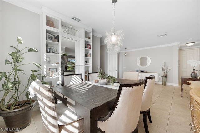 dining area featuring light tile patterned floors, a notable chandelier, ornamental molding, and visible vents