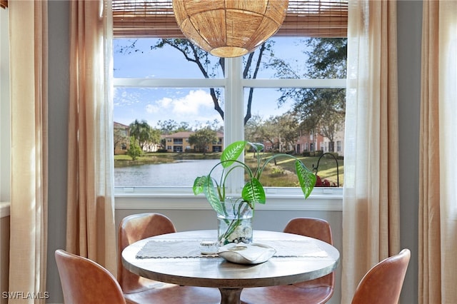 dining area featuring a water view