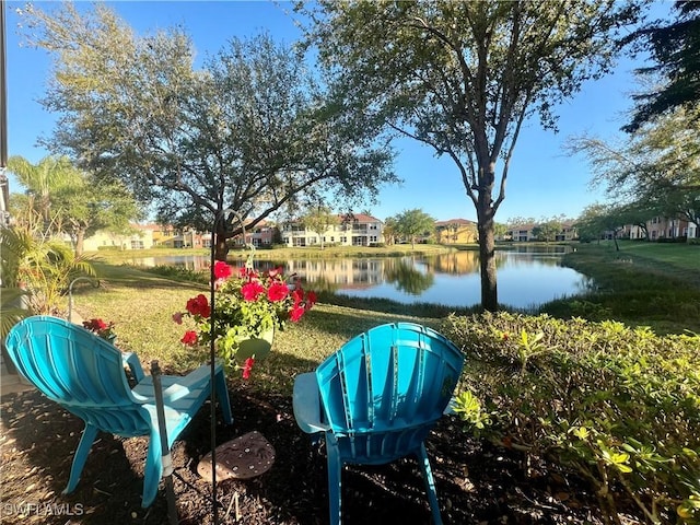 view of yard featuring a water view and a residential view