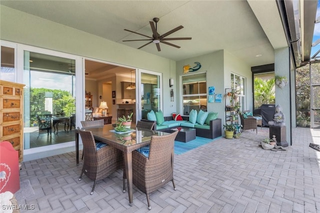 view of patio featuring ceiling fan and an outdoor living space